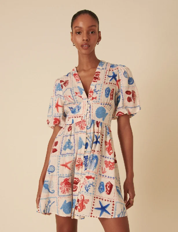 Mini dresses with criss - cross backs for a flirty look Cream Shell Print Starlight Mini Dress Mini dresses with criss - cross backs for a flirty look Cream Shell Print Starlight Mini Dress