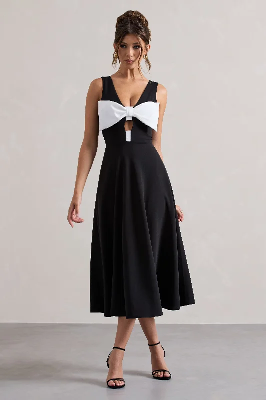 Midi dresses with gathered skirts for a full and flowing silhouette Primrose | Black Plunge-Neck Midi Dress With White Bow Midi dresses with gathered skirts for a full and flowing silhouette Primrose | Black Plunge-Neck Midi Dress With White Bow