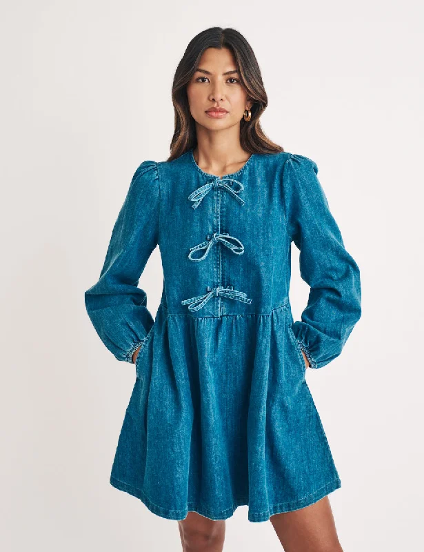 Mini dresses with asymmetric hems for a fashion - forward look Denim Tie Front Eden Mini Dress Mini dresses with asymmetric hems for a fashion - forward look Denim Tie Front Eden Mini Dress