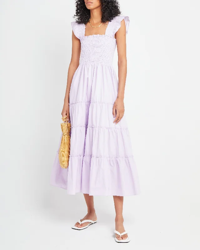 Midi dresses with pom - pom trims for a playful and festive look Calypso Maxi Dress