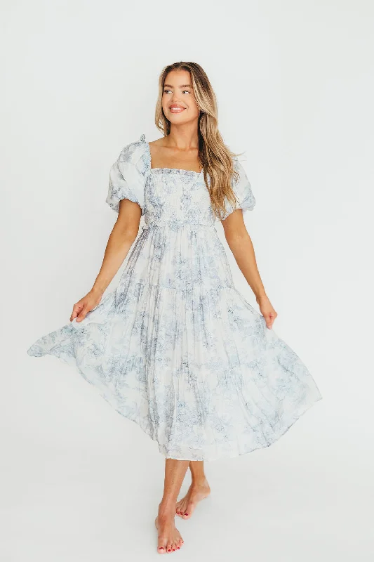 Midi dresses with belted waists to accentuate the figure Elena Floral Print Smocked Midi Dress in Blue Floral- Bump Friendly (Restocking 4/7) Midi dresses with belted waists to accentuate the figure Elena Floral Print Smocked Midi Dress in Blue Floral- Bump Friendly (Restocking 4/7)
